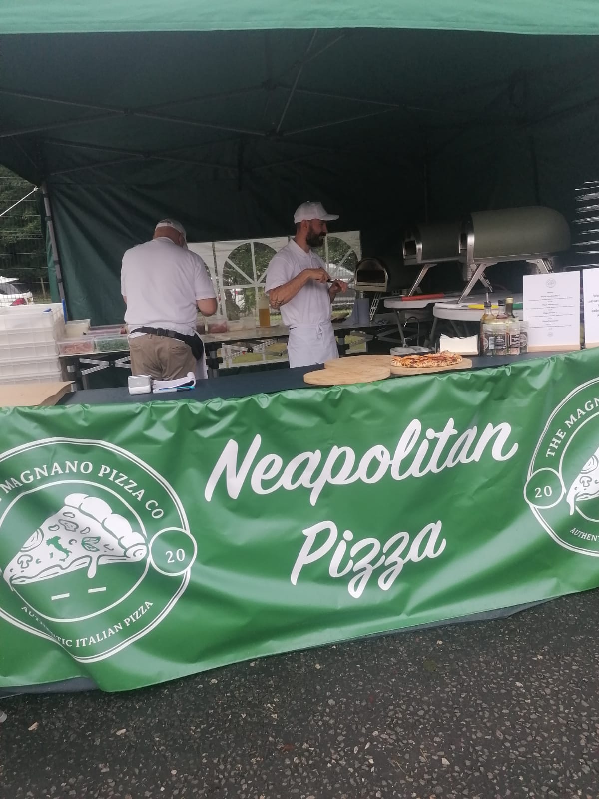 Guests enjoying authentic Italian pizza